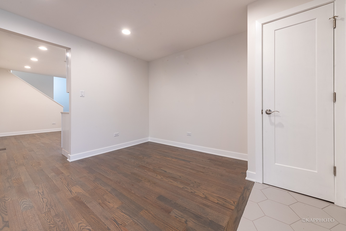 5654 South Princeton Avenue Chicago, IL 60621 - Photo 6 of 29 an empty room with wooden floor and entrance