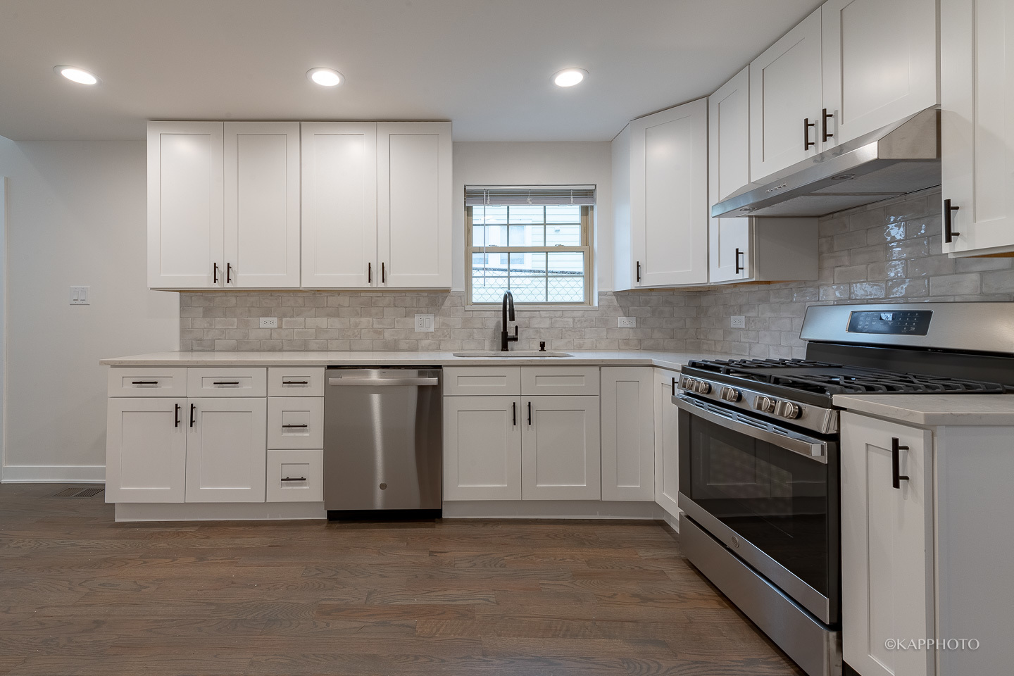 5654 South Princeton Avenue Chicago, IL 60621 - Photo 9 of 29 a kitchen with granite countertop cabinets stainless steel appliances and a sink