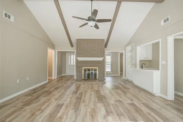 a view of livingroom with hardwood floor and a ceiling fan