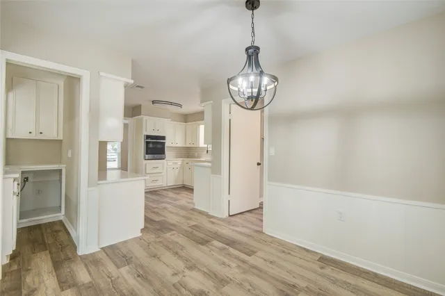 a view of a kitchen from the hallway
