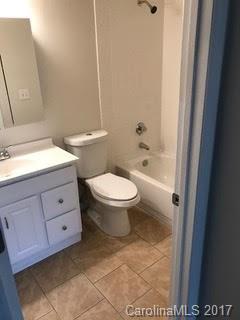 11016 Running Ridge Road Charlotte, NC 28226 - Photo 8 of 8 a bathroom with a toilet a sink and a mirror