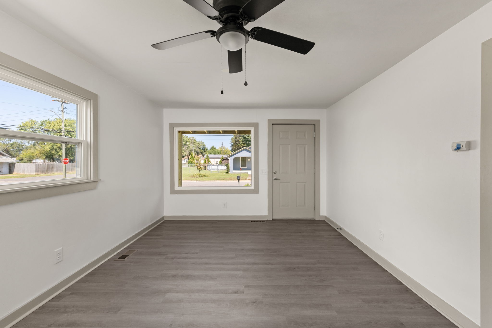 503 5th Street Lawrenceburg, TN 38464 - Photo 12 of 19 wooden floor in an empty room with a window