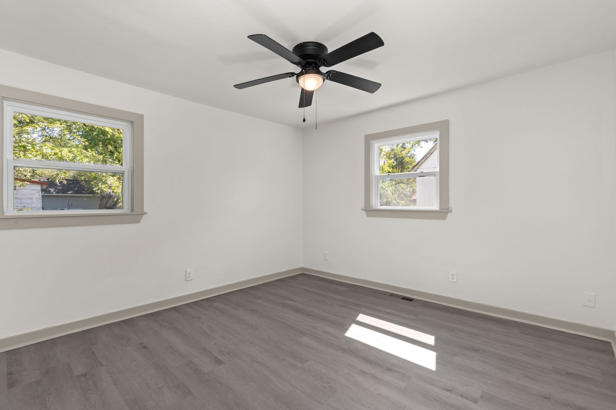 503 5th Street Lawrenceburg, TN 38464 - Photo 16 of 19 wooden floor in an empty room with a window