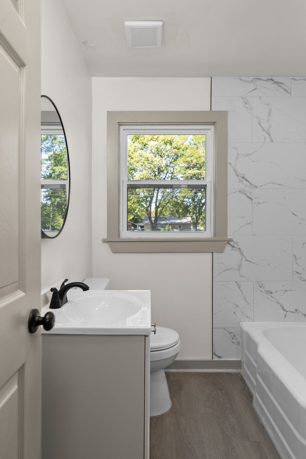 503 5th Street Lawrenceburg, TN 38464 - Photo 5 of 19 a bathroom with a sink a toilet and a window