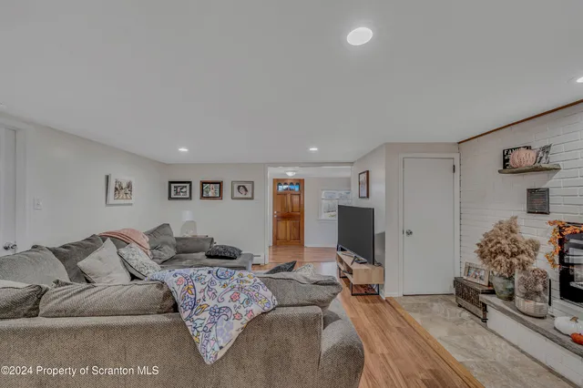 a bedroom with a large bed and a couch