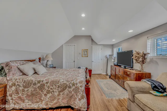 a bed room with a bed and a couch