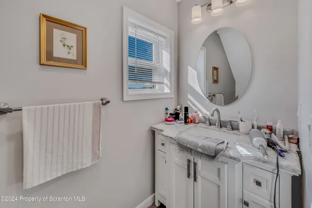 a view of a hallway with shower curtain