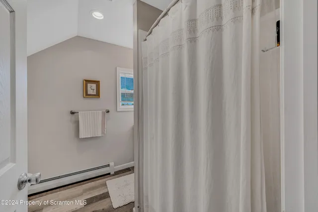 a view of bathroom with a washer and dryer