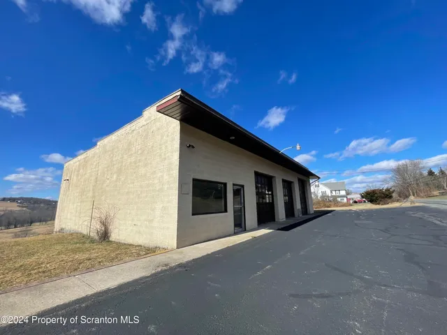a view of a street with an ocean view