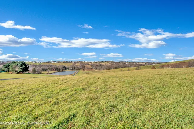 a view of an ocean and a yard