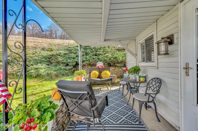 a outdoor living space with furniture and garden view