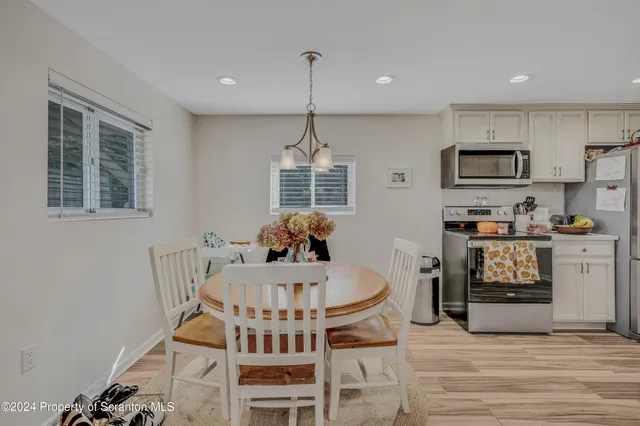 a view of a dining room with furniture