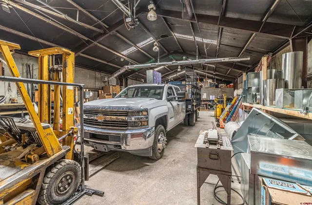 a view of a garage with parked cars