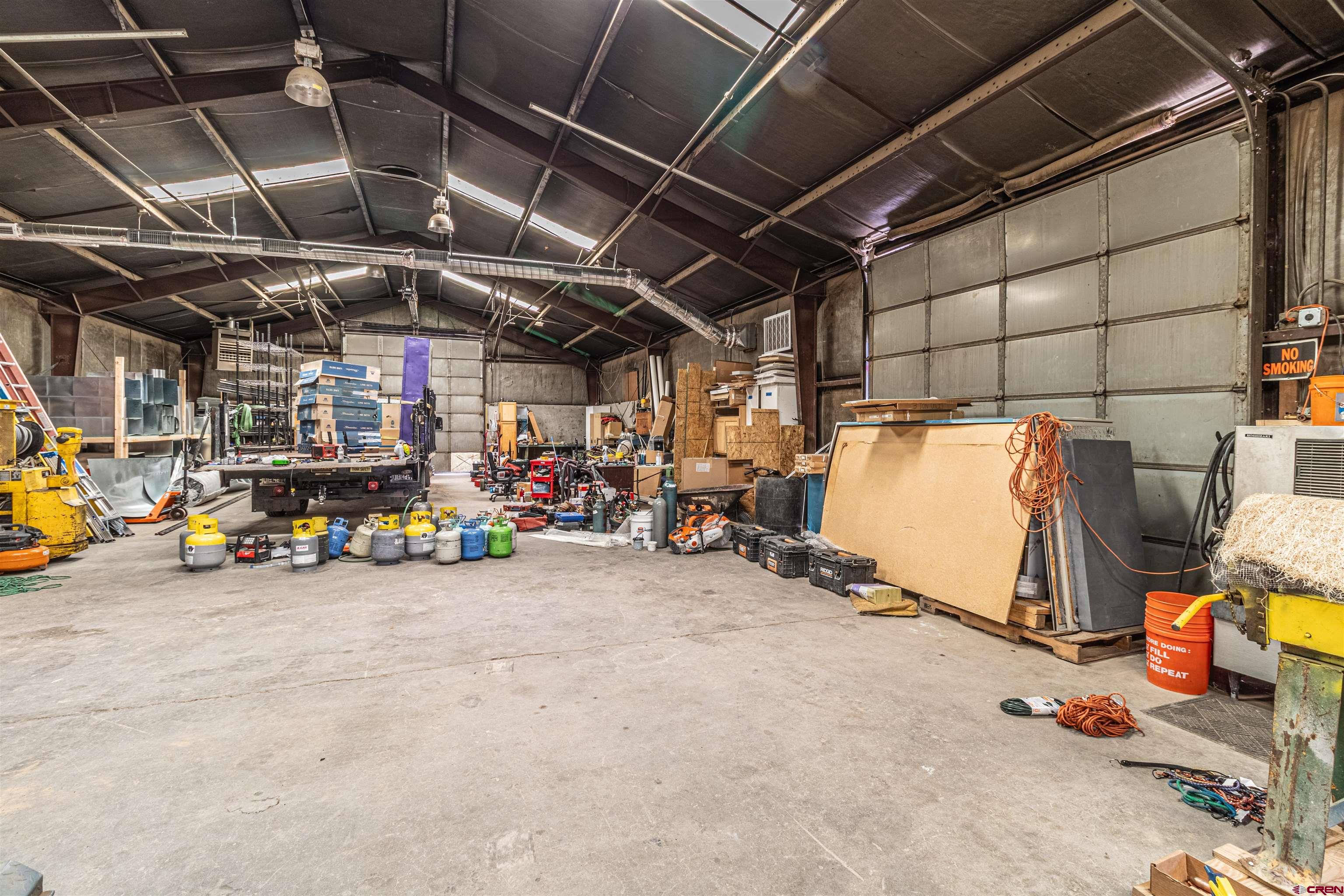 4200 Monroe Road Farmington, NM 87401 - Photo 33 of 45 a view of a garage with parked cars