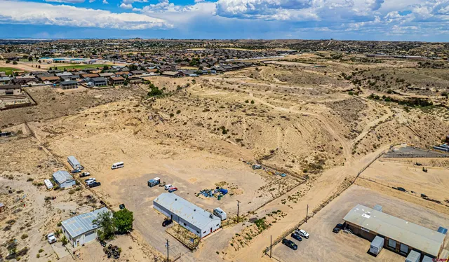 a view of water heater room with wooden floor