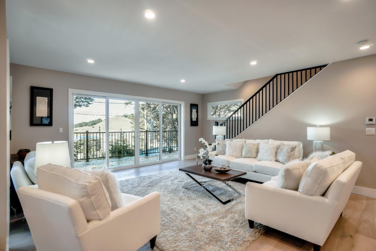 408 San Pablo Terrace Pacifica, CA 94044 - Photo 11 of 34 a living room with furniture and a large window