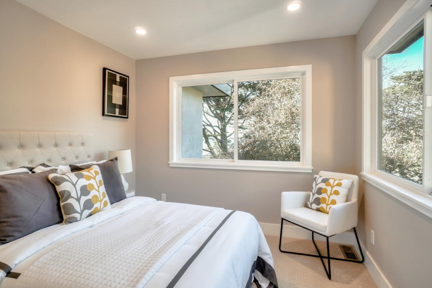 408 San Pablo Terrace Pacifica, CA 94044 - Photo 16 of 34 a bedroom with a bed and a window