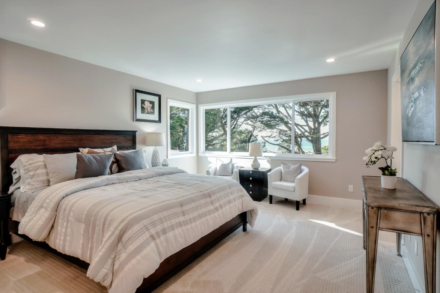 408 San Pablo Terrace Pacifica, CA 94044 - Photo 19 of 34 a bedroom with a bed and large windows