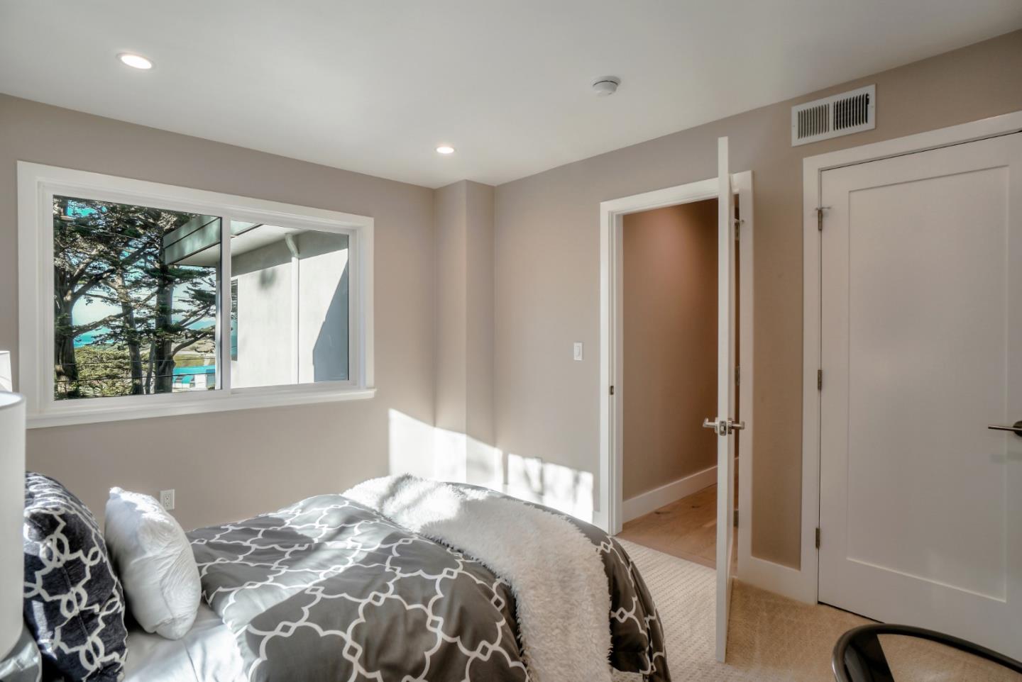 408 San Pablo Terrace Pacifica, CA 94044 - Photo 26 of 34 a bedroom with a bed and a window