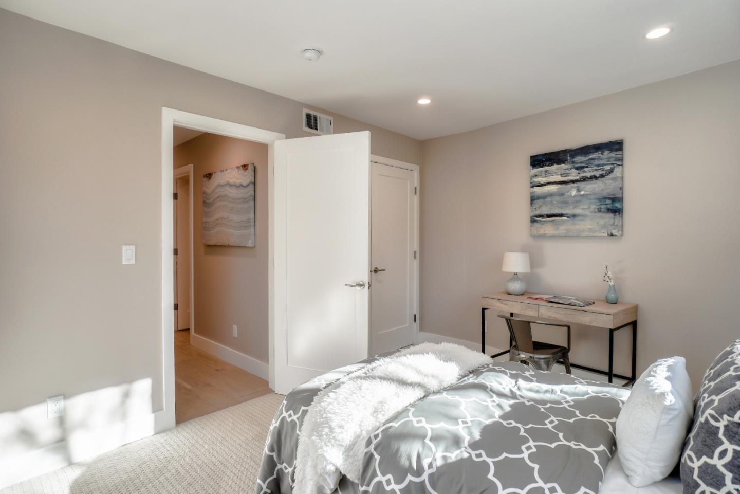 408 San Pablo Terrace Pacifica, CA 94044 - Photo 27 of 34 a bedroom with a bed and a chair in it