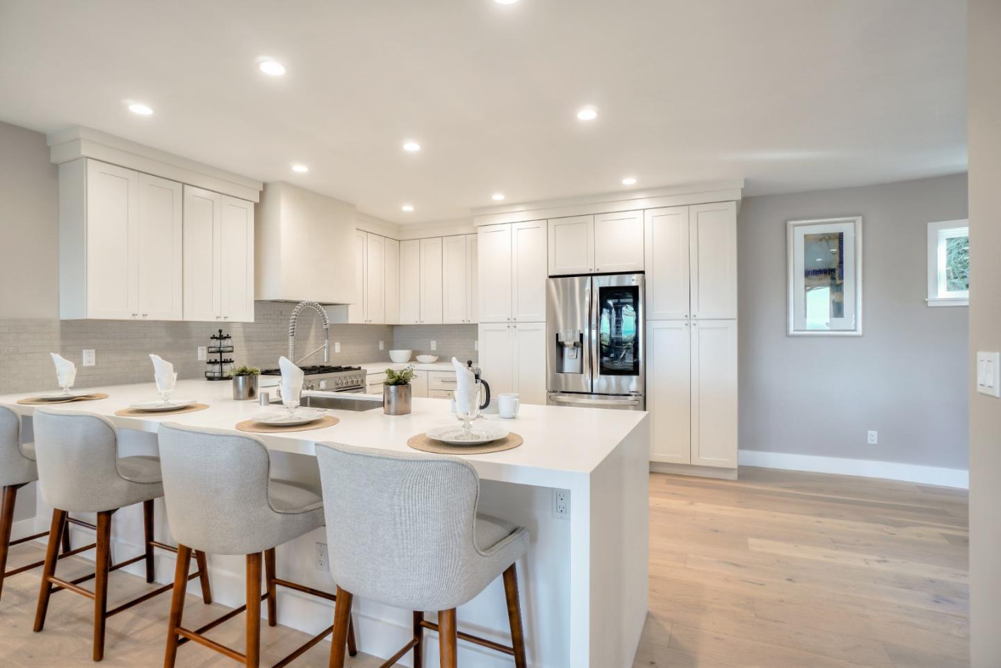 408 San Pablo Terrace Pacifica, CA 94044 - Photo 6 of 34 a kitchen with a sink and chairs