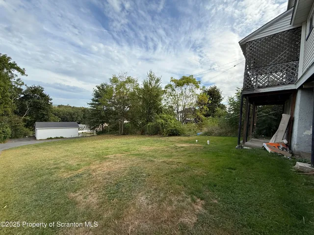 a fire hydrant in the middle of a field
