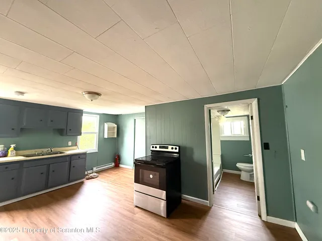 a view of a kitchen with a sink and a dishwasher