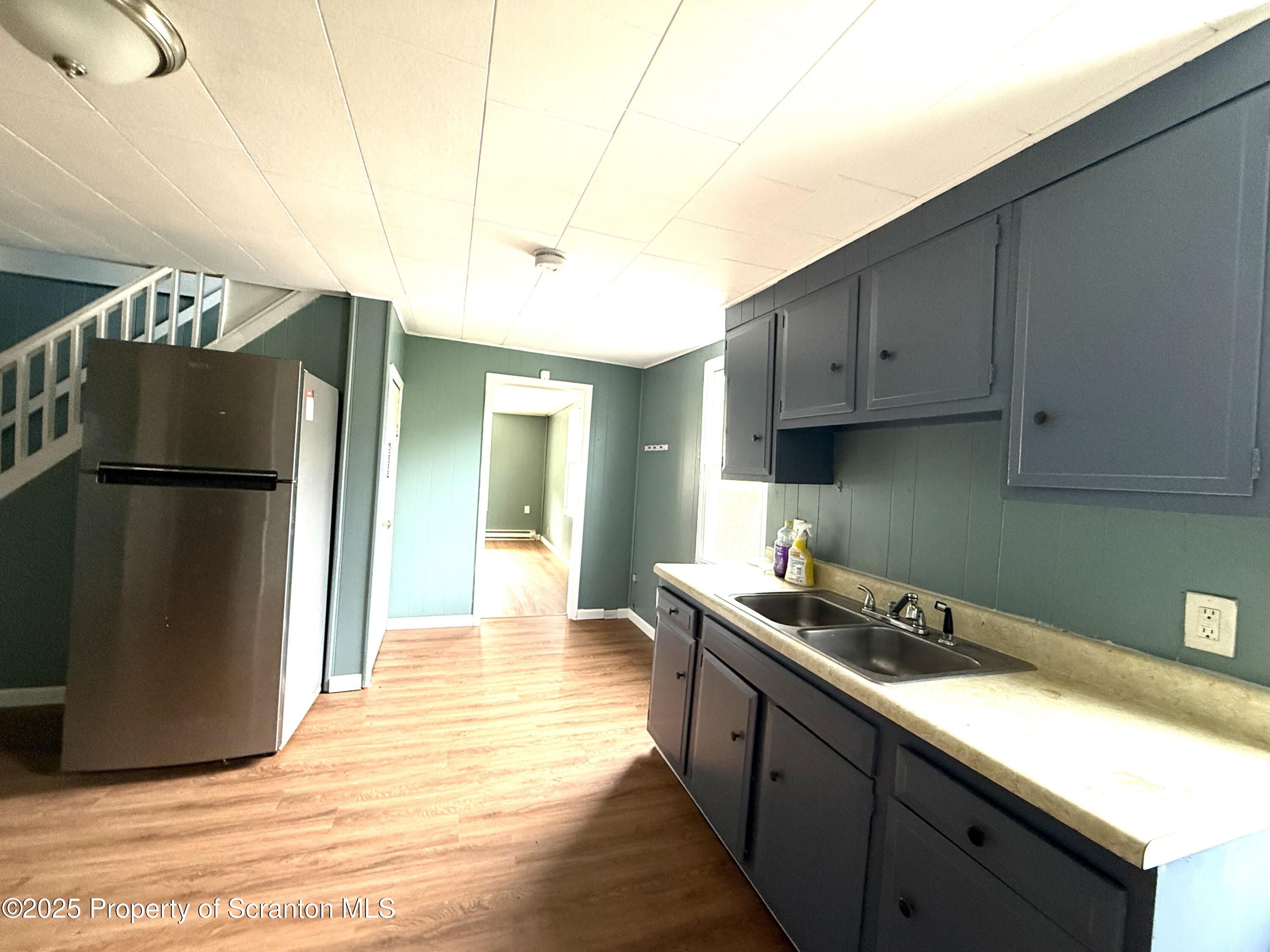 755 Main Street Sugar Notch, PA 18706 - Photo 3 of 13 a kitchen with stainless steel appliances granite countertop a refrigerator a sink and a stove