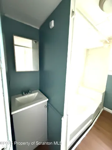 a utility room with a sink dryer and washer