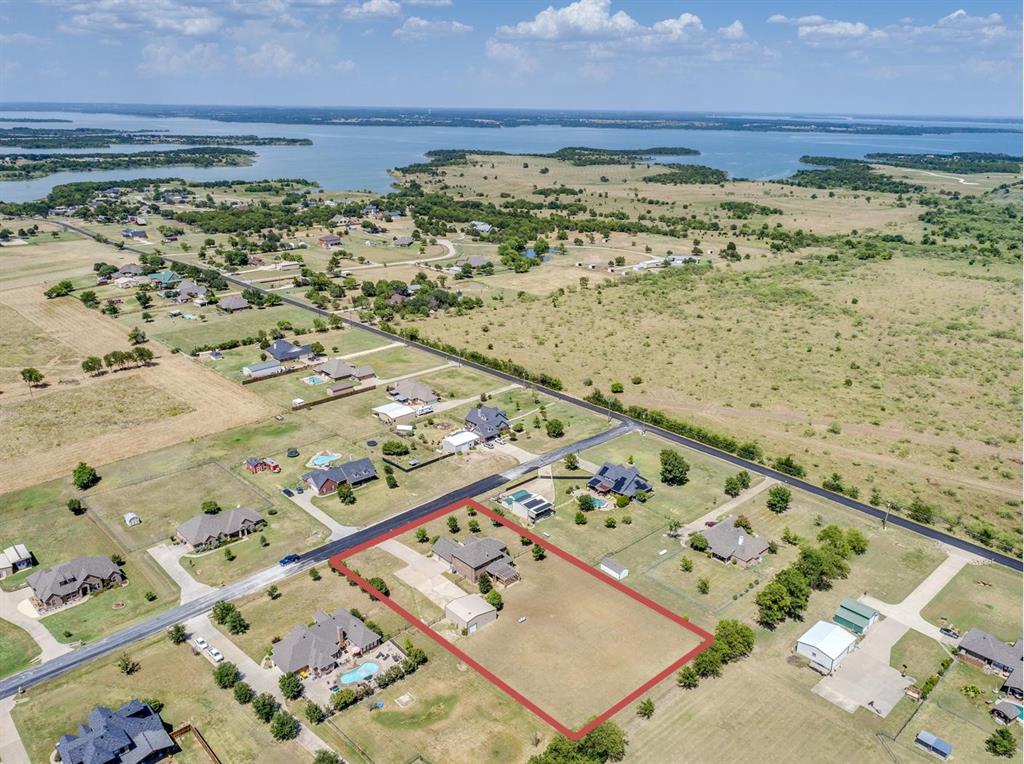 401 Ridgecrest Place Sanger, TX 76266 - Photo 1 of 1 Aerial view of property and surrounding area with property boundaries highlighted and a Lake Ray Roberts nearby.