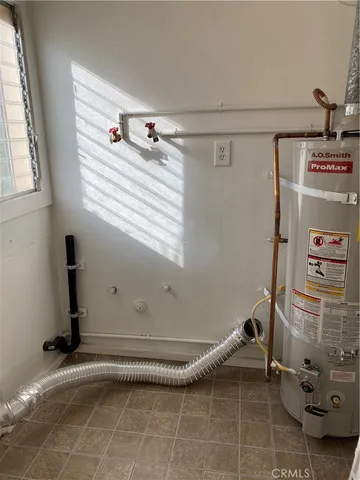 a bathroom with a window and a shower