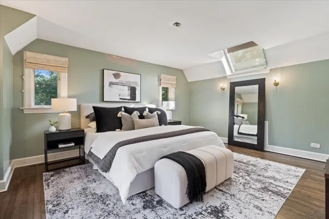 a bedroom with a bed and a flat screen television