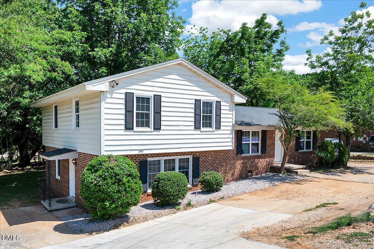 3408 Atlantic Avenue Raleigh, NC 27604 - Photo 2 of 48 a front view of a house with a yard