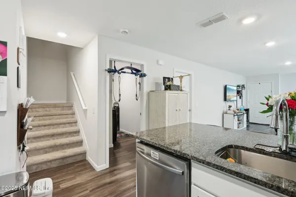 a kitchen with a sink and a refrigerator
