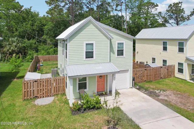 a front view of a house with a yard and porch