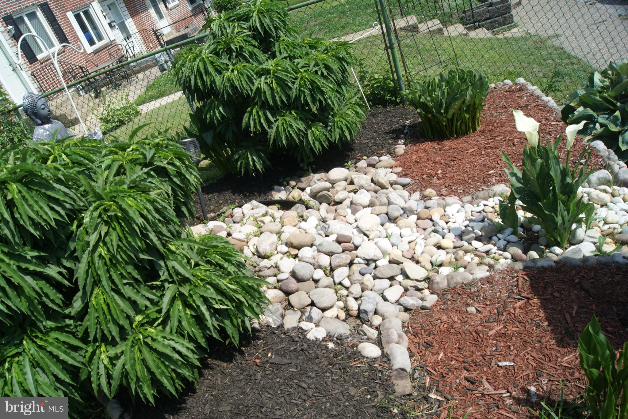 735 Grant Road Folcroft, PA 19032 - Photo 4 of 57 Serene garden oasis with stone paths.