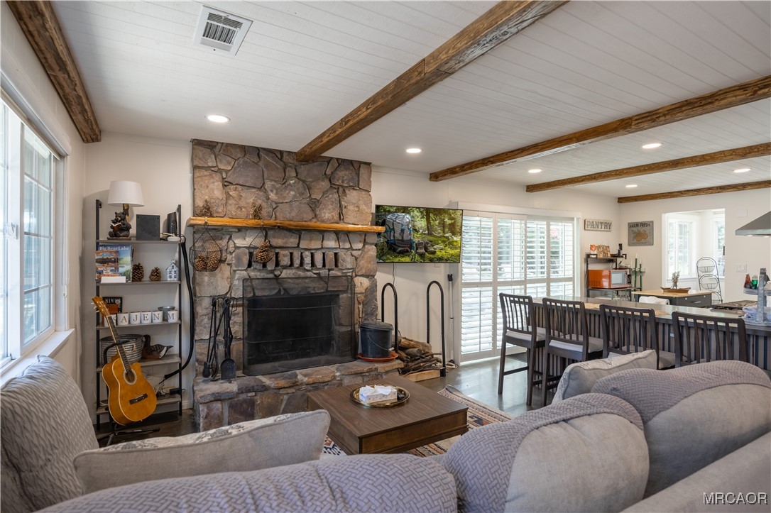 682 Maple Lane Sugarloaf, CA 92386 - Photo 4 of 20 a living room with furniture and a fireplace