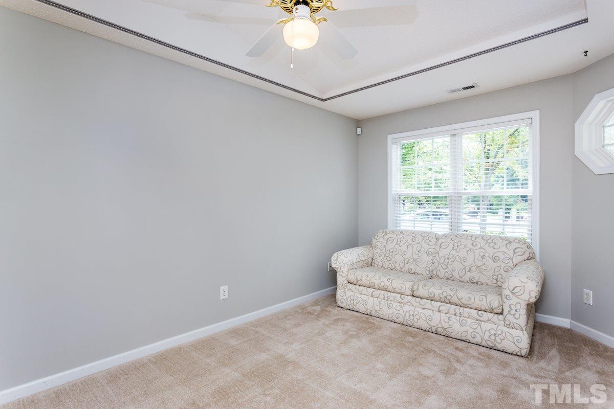 3752 Votive Lane Raleigh, NC 27604 - Photo 4 of 22 a living room with furniture and a window