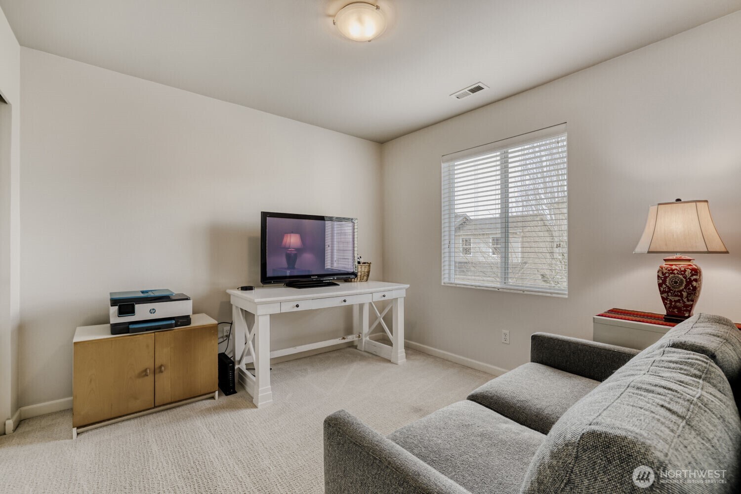 18705 101st Avenue Northeast, Unit 3 Bothell, WA 98011 - Photo 15 of 31 a living room with furniture and a flat screen tv