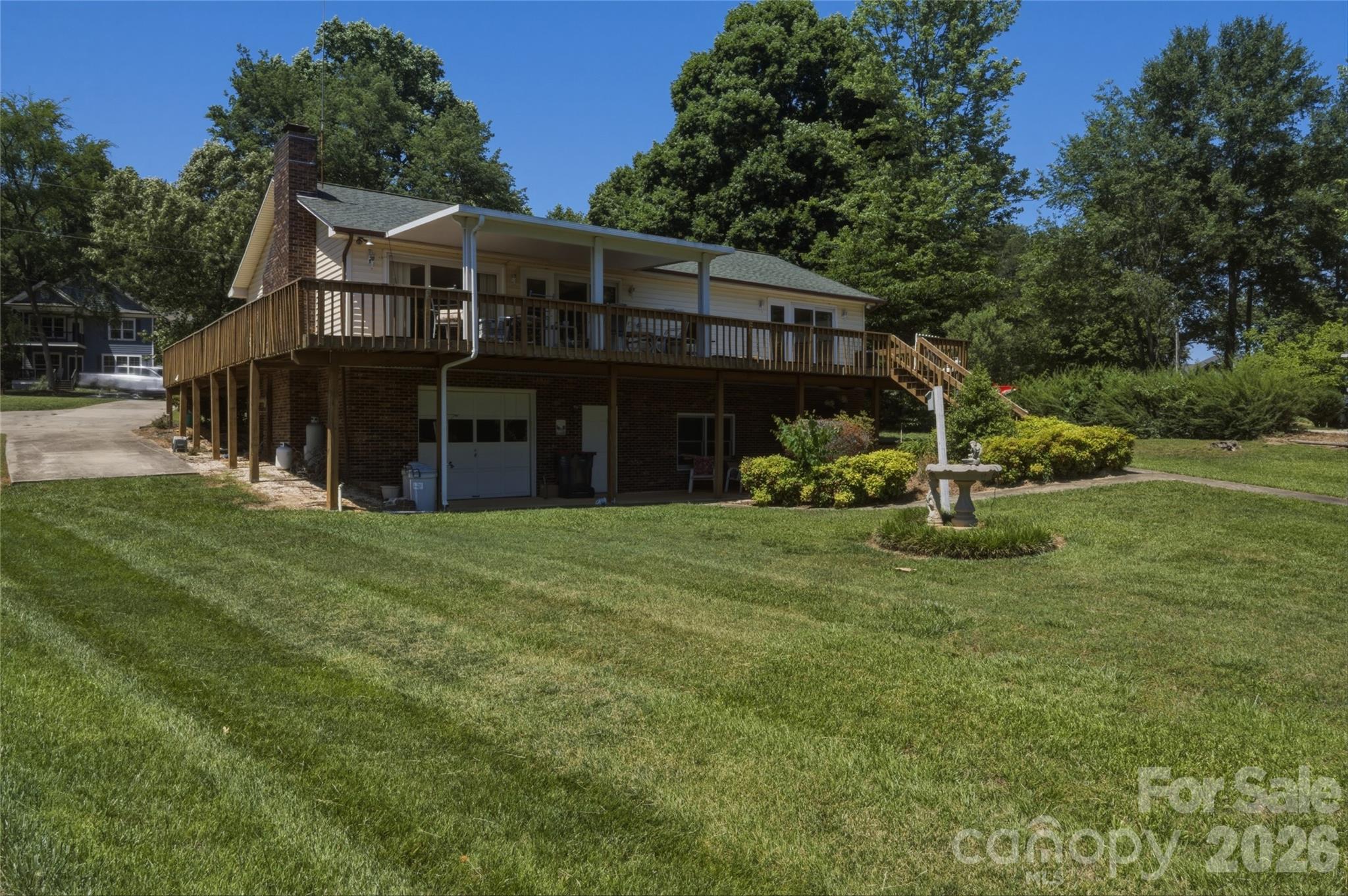 8226 Normandy Road Denver, NC 28037 - Photo 29 of 29 a view of a house with a yard and sitting area