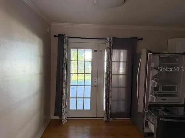 a kitchen with a refrigerator and window