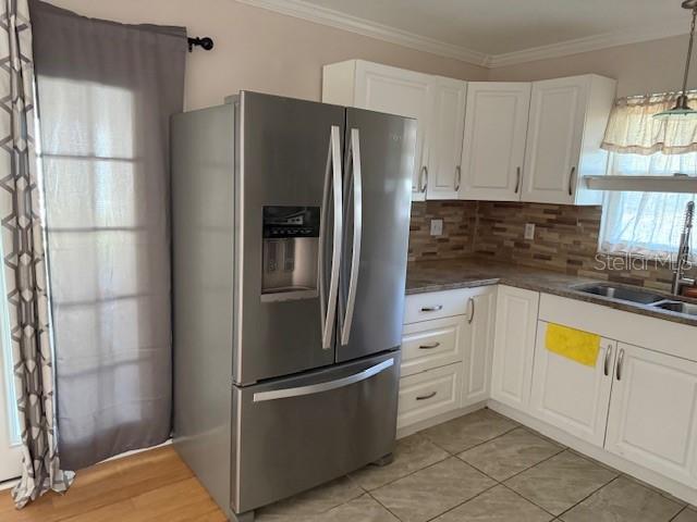 8 Silver Way Ocala, FL 34472 - Photo 8 of 19 a kitchen with stainless steel appliances granite countertop a refrigerator and a stove