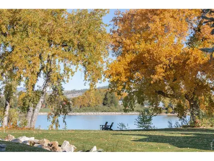 a view of houses with outdoor space and lake view