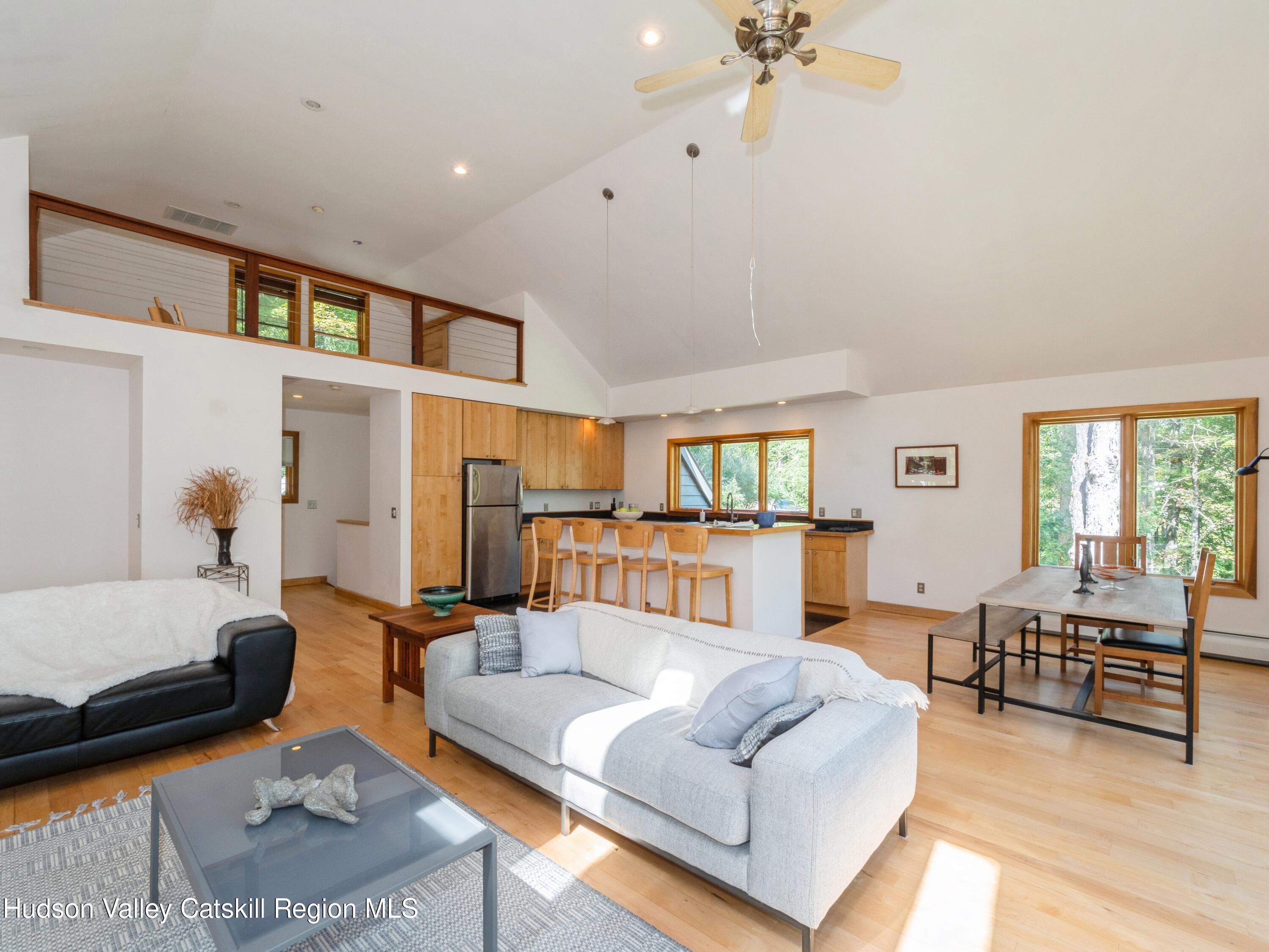 7 Clovewood Road High Falls, NY 12440 - Photo 12 of 41 a living room with furniture and a chandelier