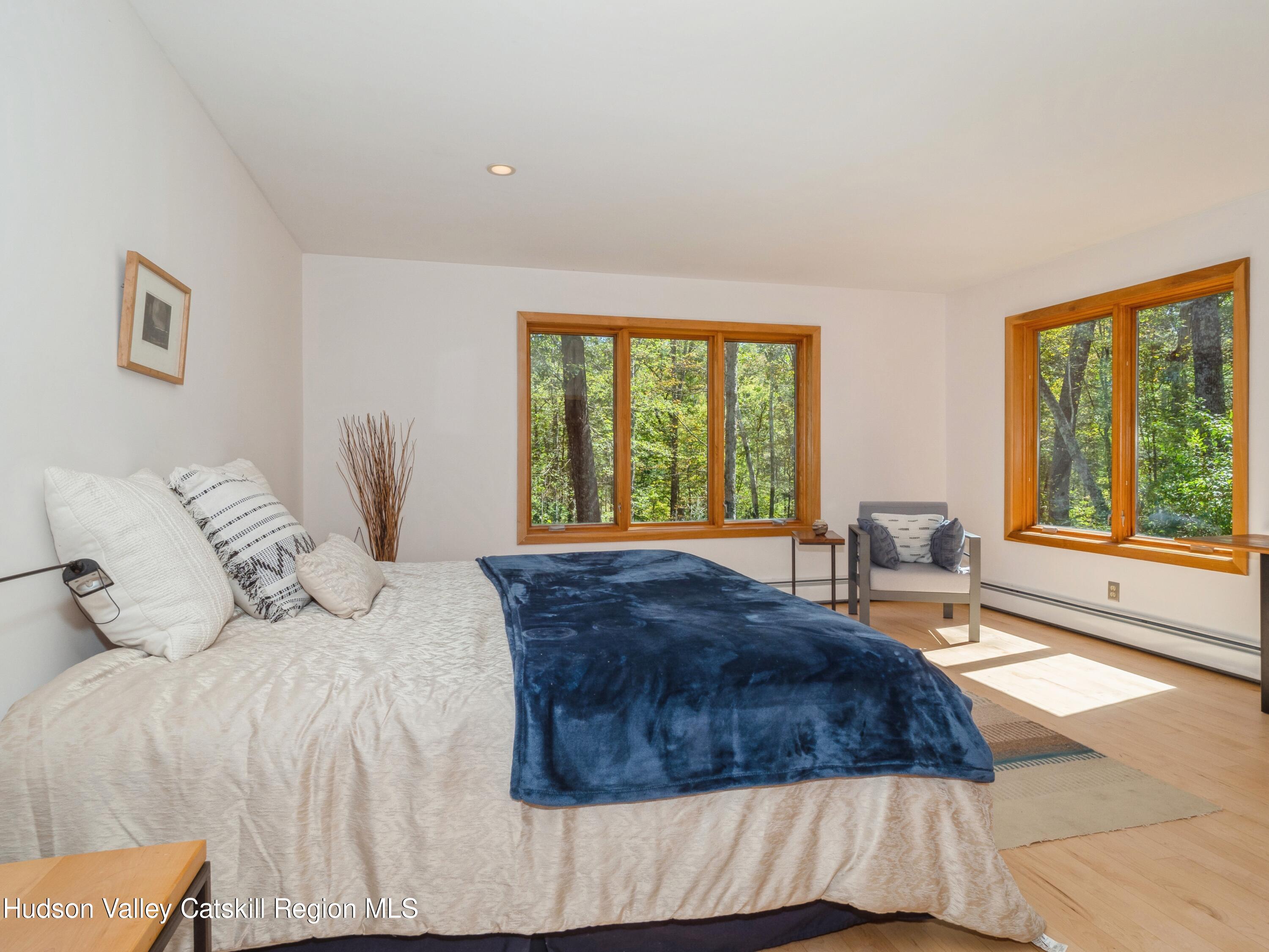 7 Clovewood Road High Falls, NY 12440 - Photo 21 of 41 a bedroom with a large bed and a large window