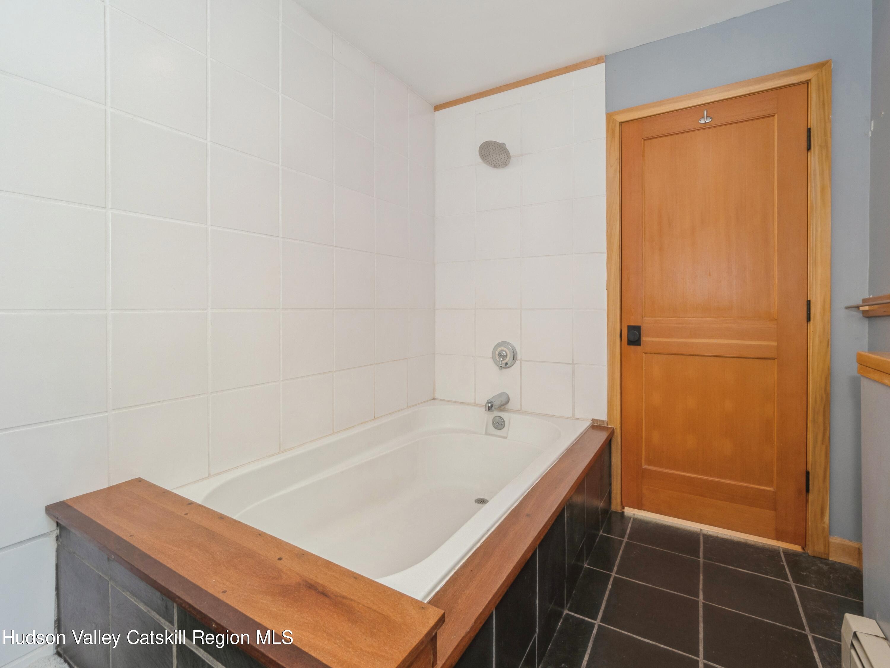 7 Clovewood Road High Falls, NY 12440 - Photo 24 of 41 a bathroom with a tub and a shower