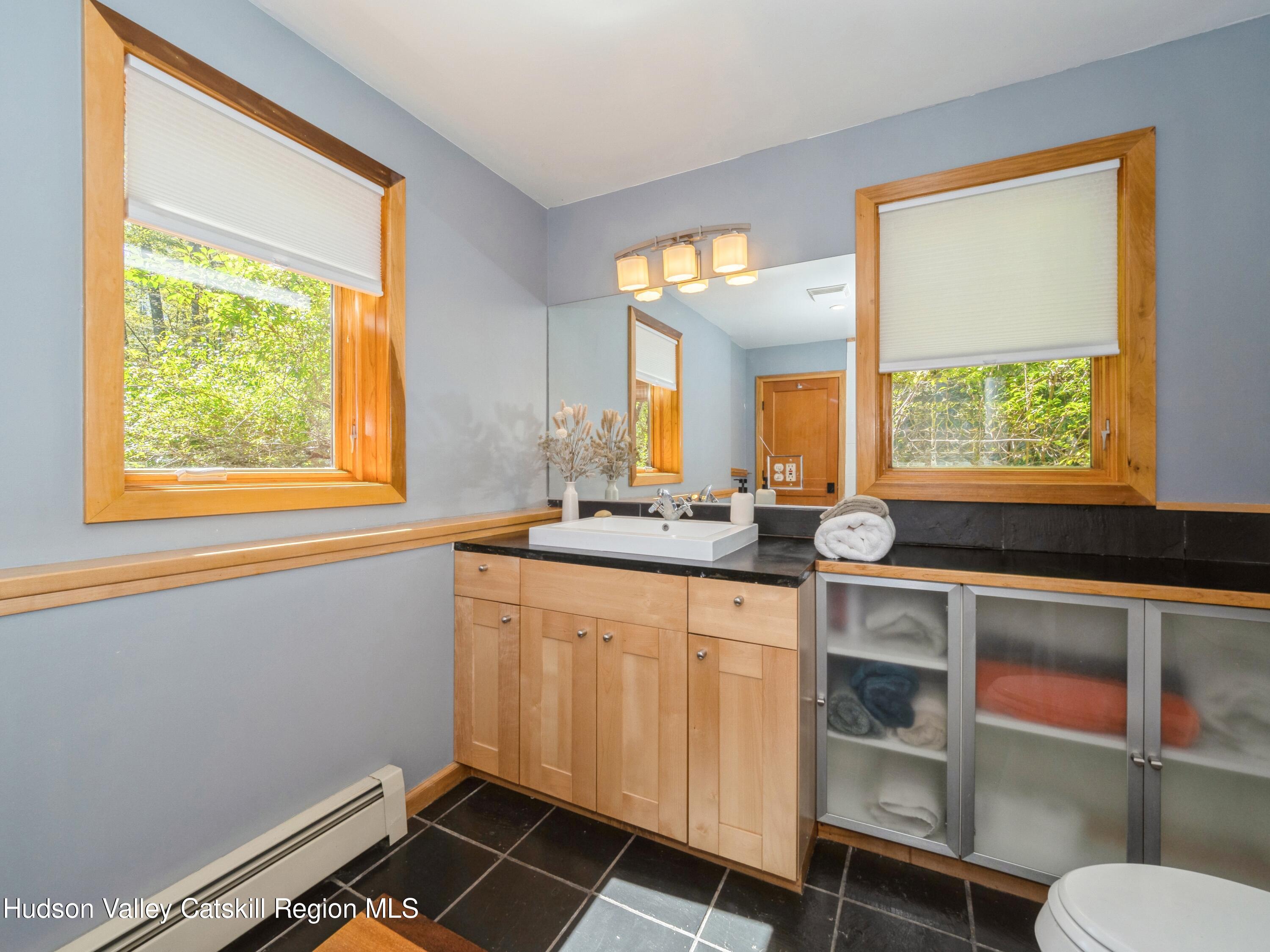 7 Clovewood Road High Falls, NY 12440 - Photo 25 of 41 a bathroom with a sink mirror and a window