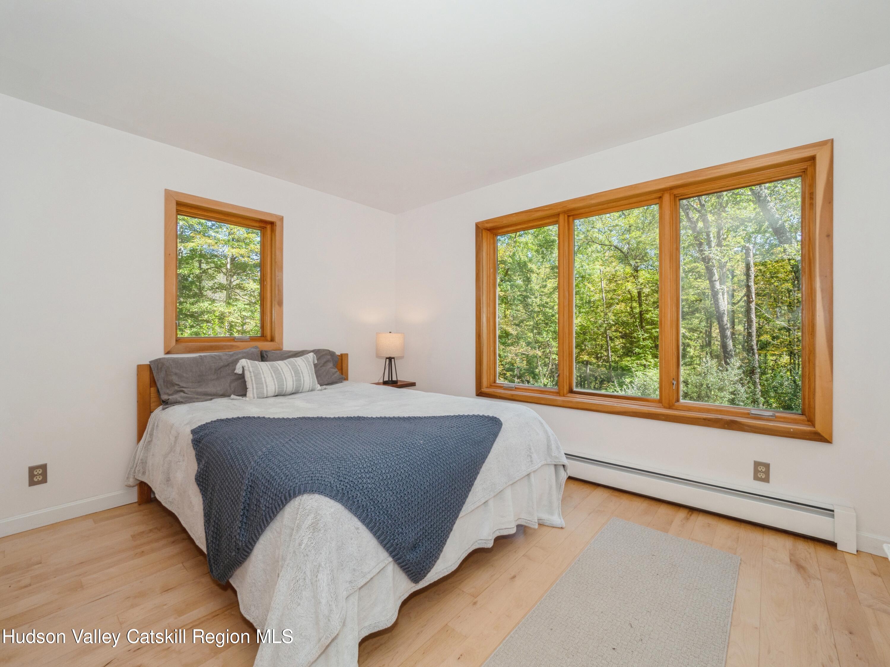 7 Clovewood Road High Falls, NY 12440 - Photo 27 of 41 a bed sitting in a bedroom next to a window