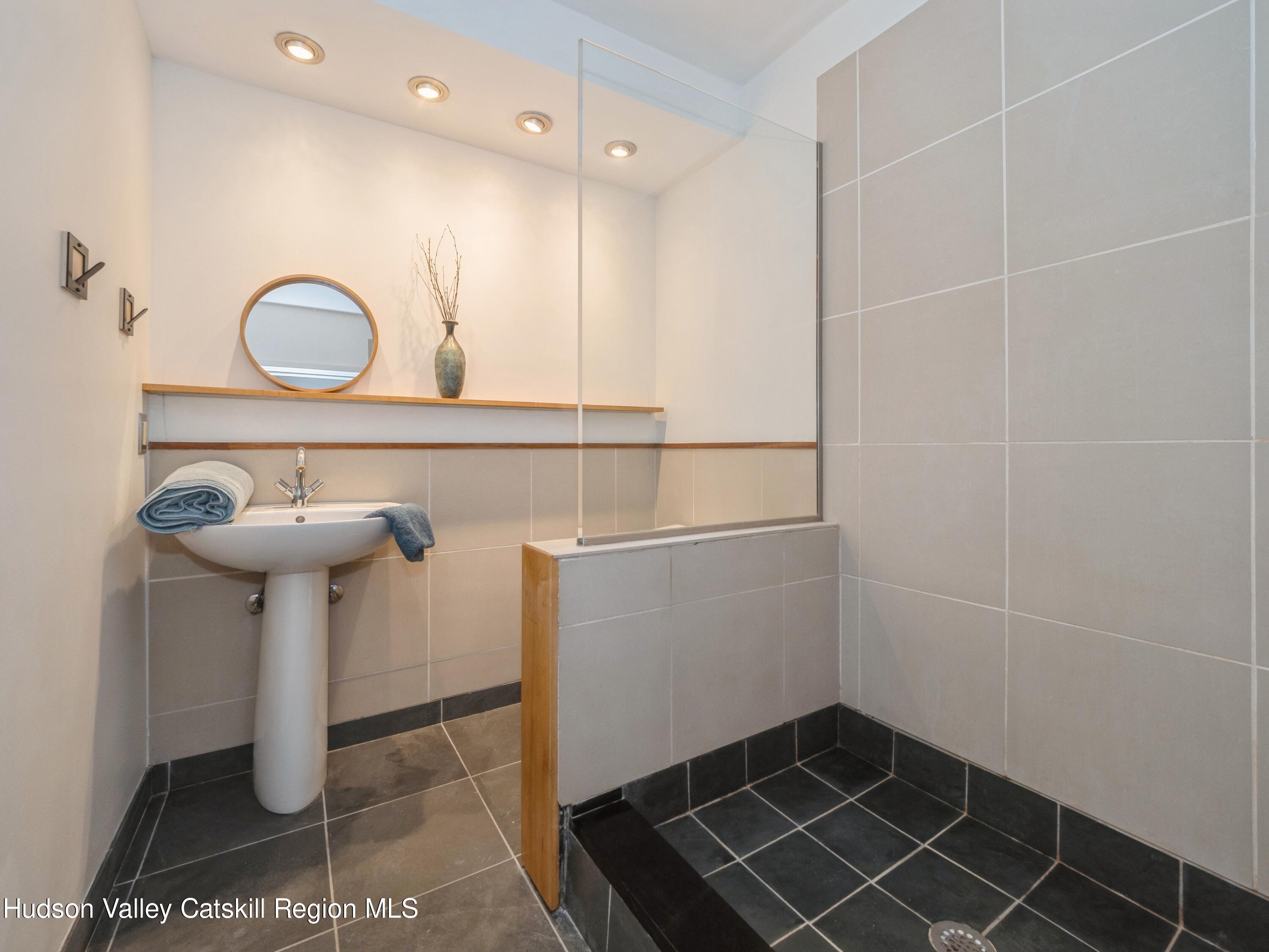 7 Clovewood Road High Falls, NY 12440 - Photo 33 of 41 a bathroom with a sink and a mirror