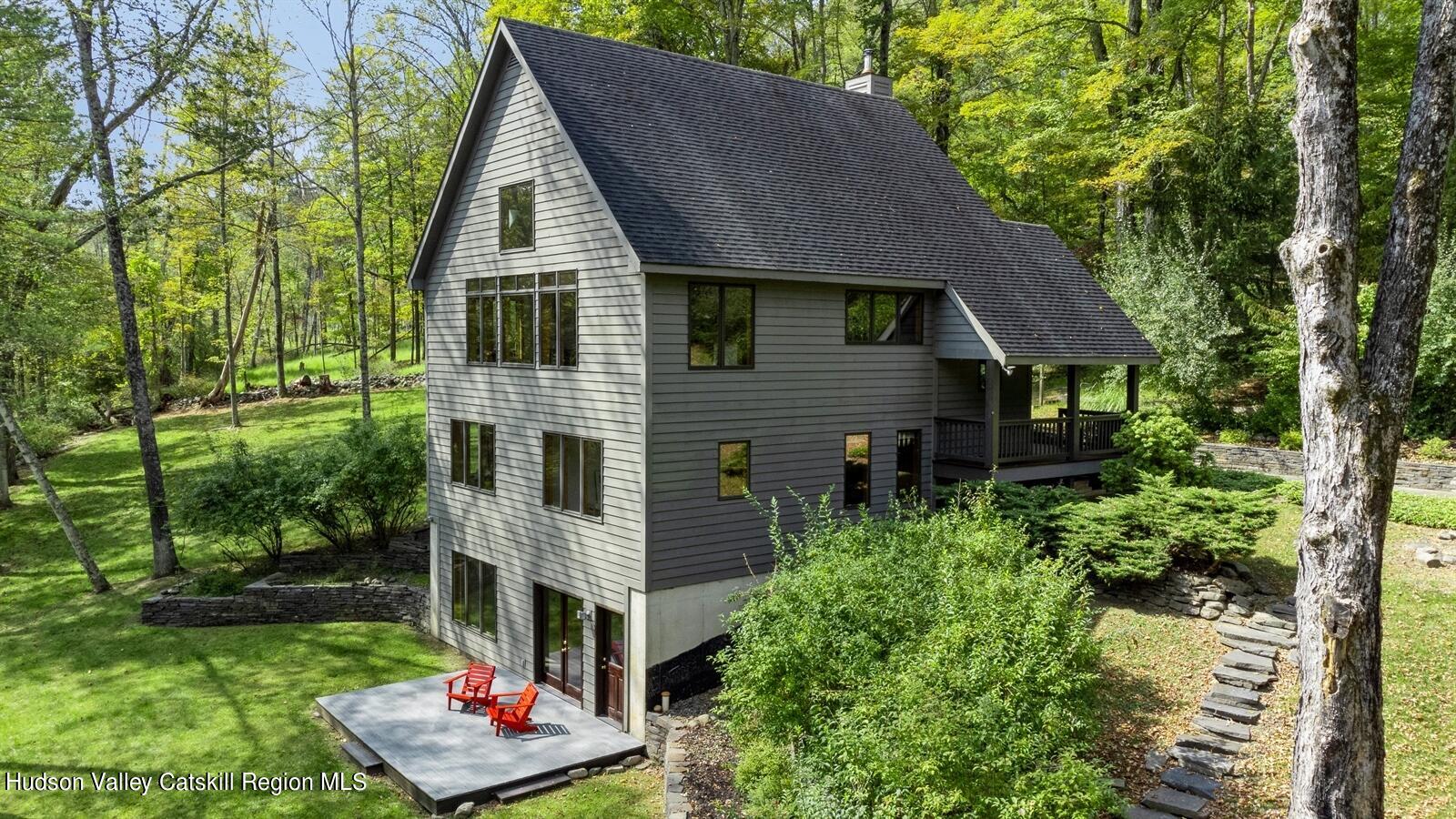 7 Clovewood Road High Falls, NY 12440 - Photo 6 of 41 a aerial view of a house with table and chairs under an umbrella